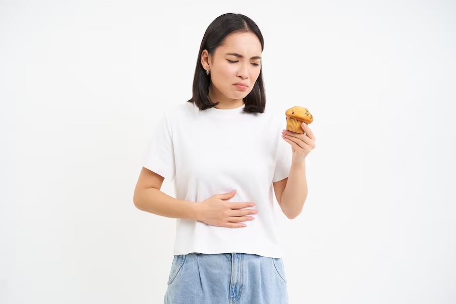 https://www.freepik.com/free-photo/portrait-asian-woman-with-stomach-ache-holding-cupcake-food-poisoning-feeling-unwell-studio-backg_45404722.htm#query=food%20intolerance&position=26&from_view=search&track=ais